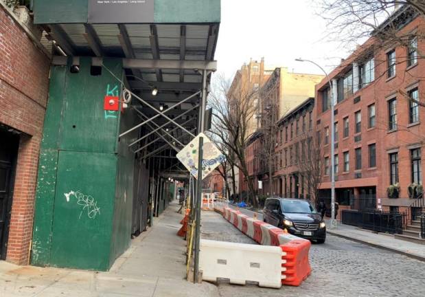 Scaffolding crowding a sidewalk in Manhattan