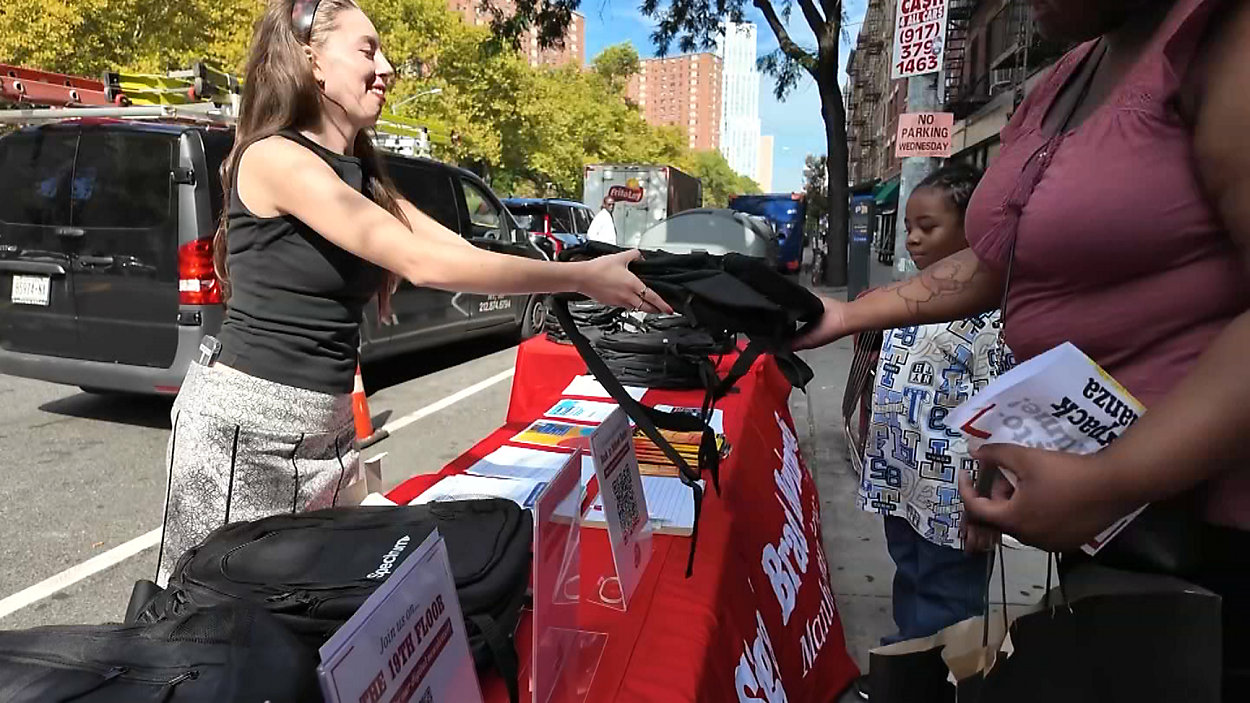 Manhattan borough president and Spectrum give away backpacks in Harlem